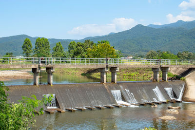 Bridge over river against sky