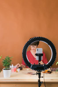 Close-up of bicycle handle against yellow background