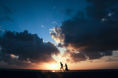 Silhouette of man at sunset