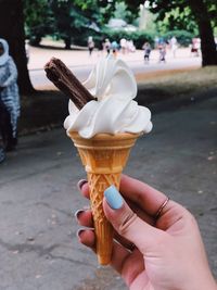 Midsection of woman holding ice cream