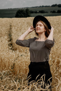 Woman standing on field