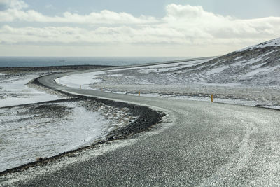 Wet and slippery road in iceland, winter