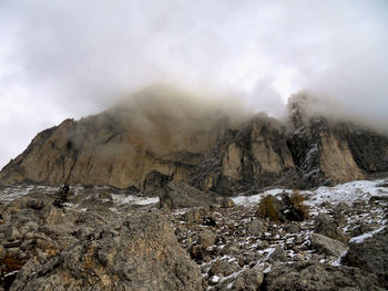 Rocks in mountains against sky