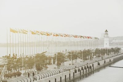 Row of built structure against sky during winter