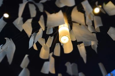 Illuminated lamp post at night