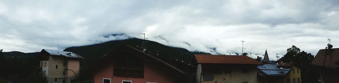 Low angle view of building against cloudy sky