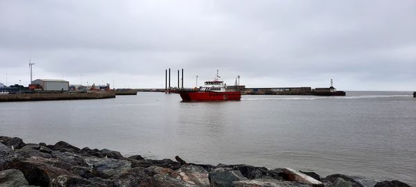 Nautical vessel on sea against sky