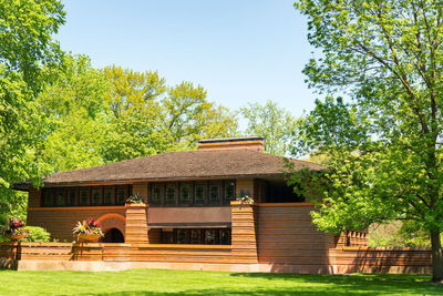 House against trees and clear sky