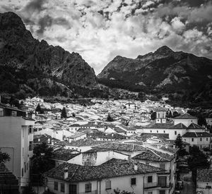 Houses in town against sky