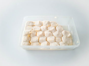 High angle view of candies in container