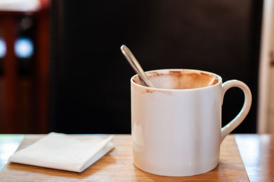 Close-up of coffee cup on table