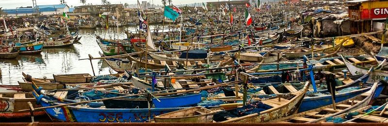 Boats moored at harbor