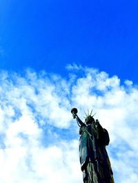 Low angle view of statue against cloudy sky