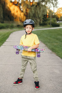 Portrait of boy standing outdoors