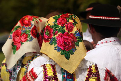 Rear view of women wearing floral pattern scarf