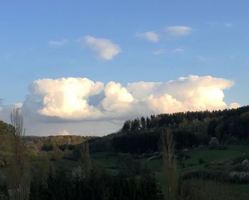 Scenic view of landscape against cloudy sky