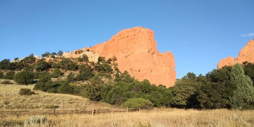 Scenic view of land against clear blue sky