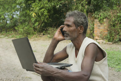 Man using mobile phone outdoors