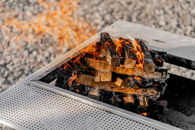 High angle view of fire on barbecue grill