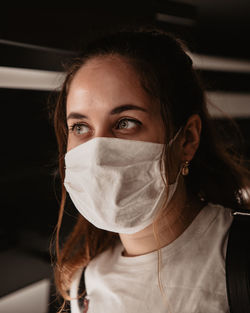 Portrait of a beautiful young woman wearing a face mask