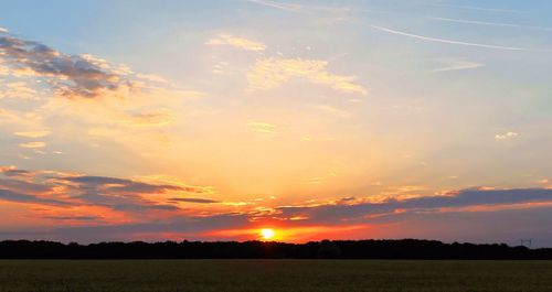 Scenic view of landscape at sunset