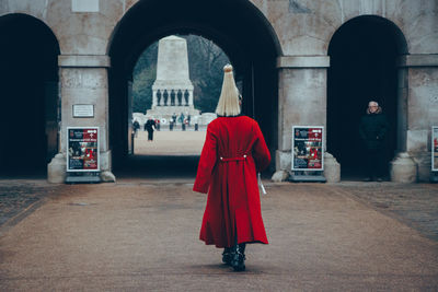 Rear view of people standing on street