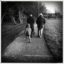 Full length of woman walking on road