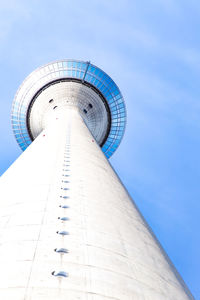 Low angle view of modern building against blue sky