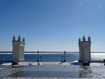 Scenic view of sea against clear blue sky