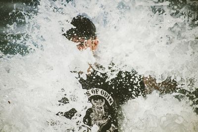 High angle view of man swimming in pool