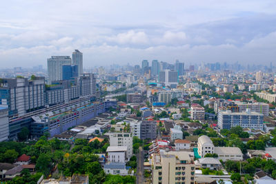 High angle view of buildings in city against sky