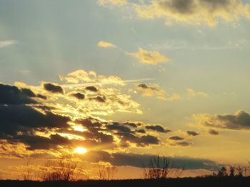 Low angle view of silhouette landscape against sky during sunset