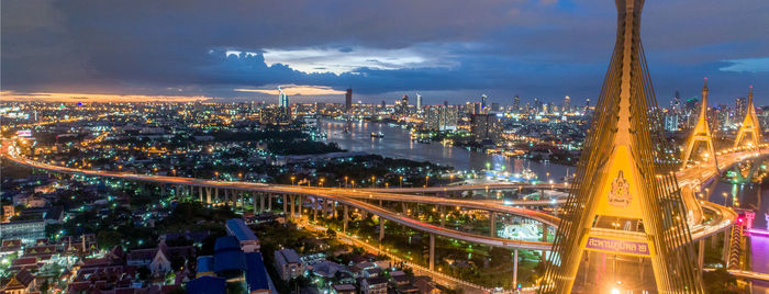 Aerial view of illuminated city buildings at night