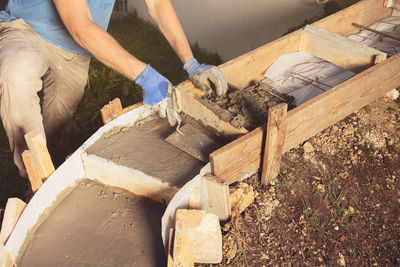 Midsection of man working at workshop