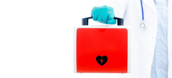 Close-up of red mailbox on white background