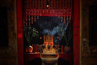 Lit candles in temple