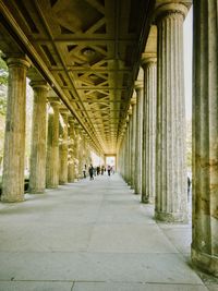 People walking in corridor of building