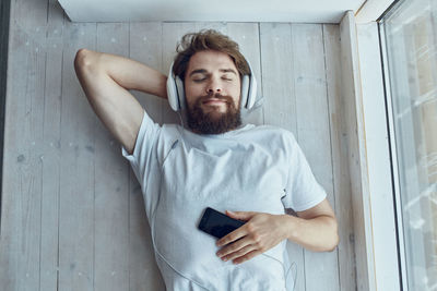 Portrait of young man using mobile phone