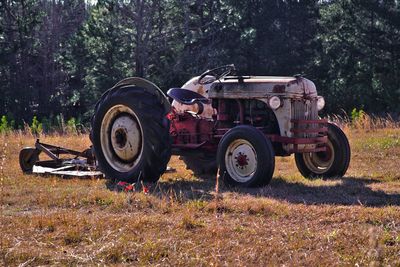 Abandoned vintage car on field