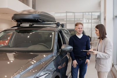 Rear view of business colleagues working on street