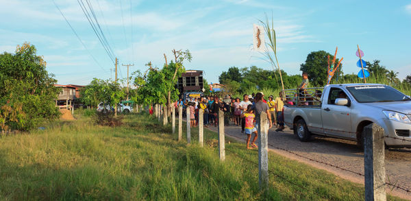 Cars on road against sky