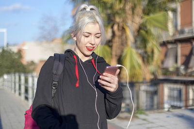 Young woman using mobile phone