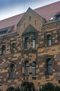 Low angle view of old building against sky