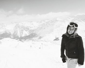 People standing on snow covered landscape