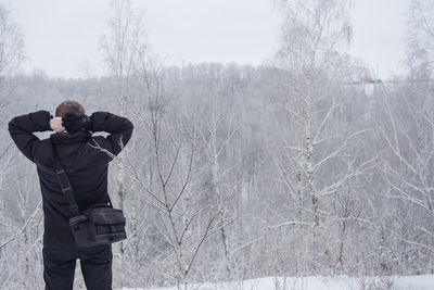 Man standing on snow covered field