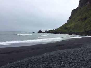 Scenic view of beach and sea against sky