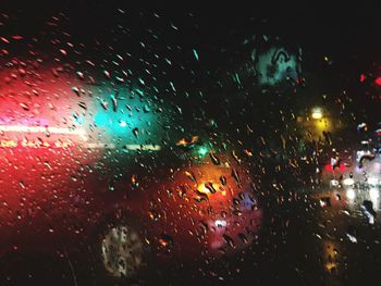 Rain drops on glass at night