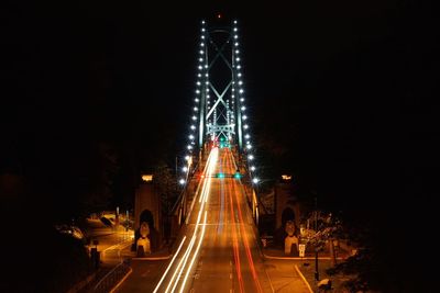 Illuminated bridge at night