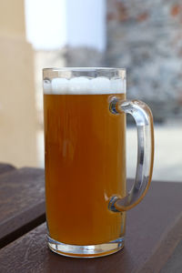 Close-up of draught beer on table