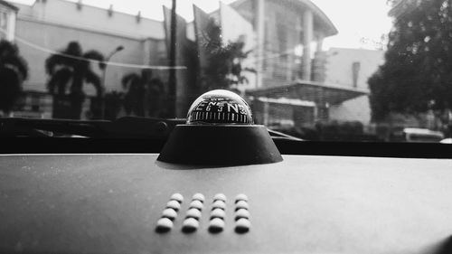 Close-up of ball on table in city